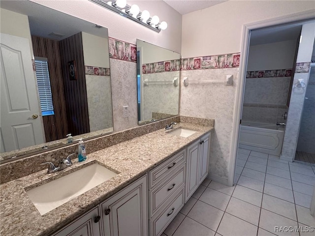 bathroom featuring vanity, tiled shower / bath combo, tile patterned flooring, and tile walls