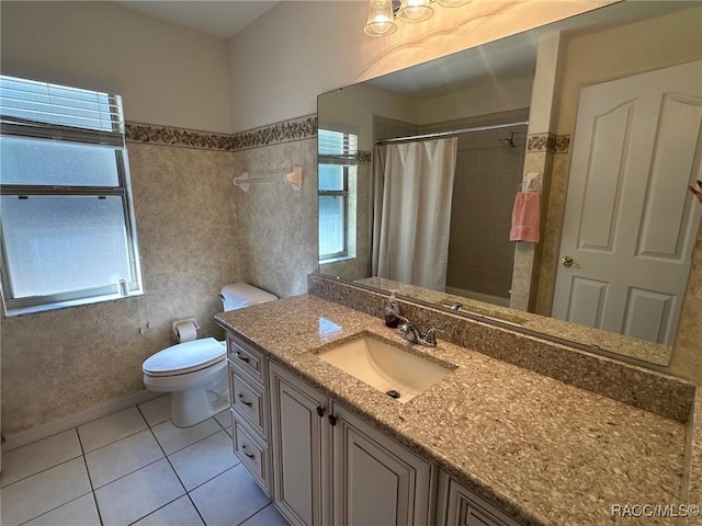 bathroom with vanity, plenty of natural light, tile patterned floors, and a shower with shower curtain