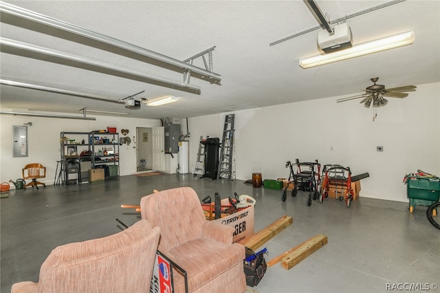 garage featuring electric panel, ceiling fan, and a garage door opener