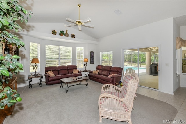 carpeted living room featuring high vaulted ceiling and ceiling fan