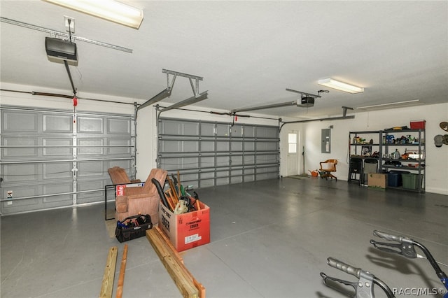 garage with electric panel and a garage door opener