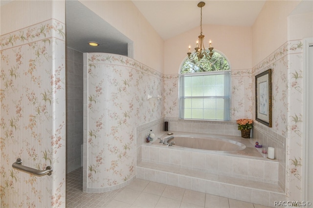 bathroom with tile patterned floors, a chandelier, vaulted ceiling, and shower with separate bathtub