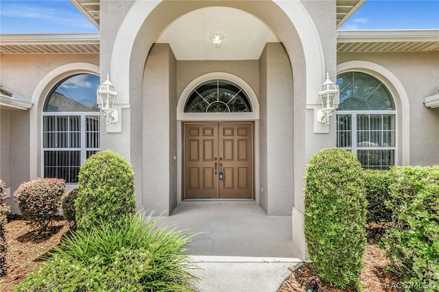 entrance to property featuring a wall mounted AC