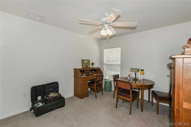 carpeted office with ceiling fan