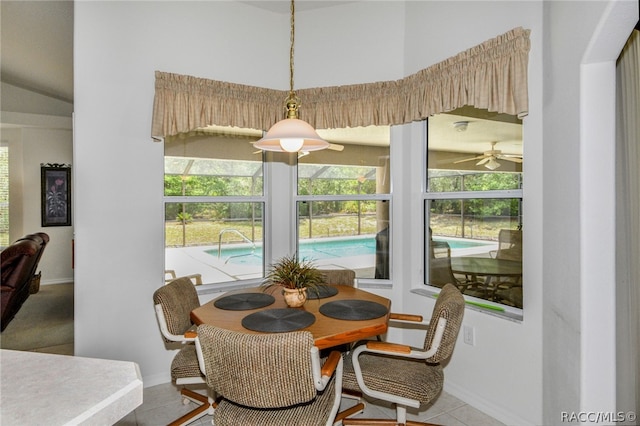 dining room featuring ceiling fan and light tile patterned floors