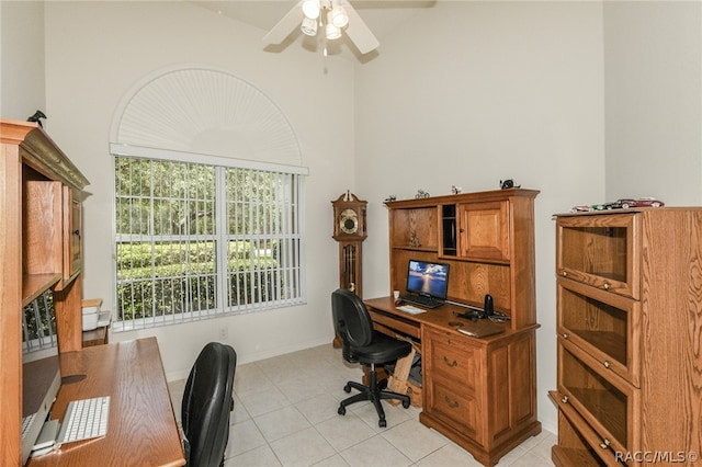 home office featuring ceiling fan and light tile patterned floors