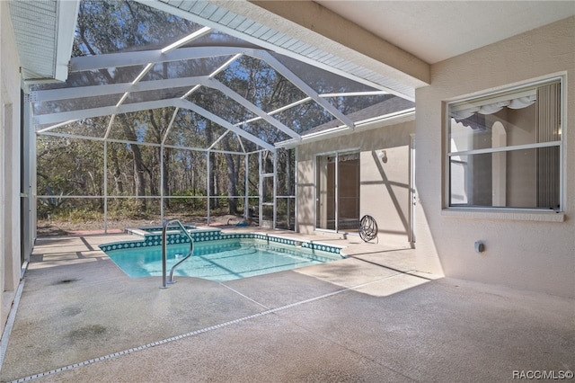 view of pool with a lanai and a patio