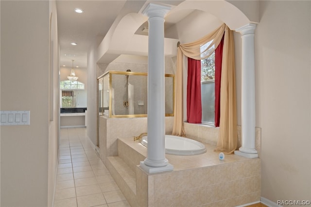 bathroom with separate shower and tub and tile patterned flooring