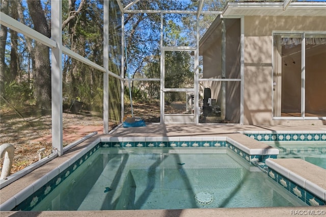 view of pool with a lanai