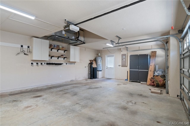 garage with strapped water heater, electric panel, and a garage door opener