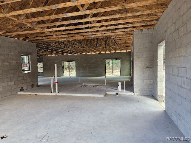 misc room with concrete flooring and plenty of natural light