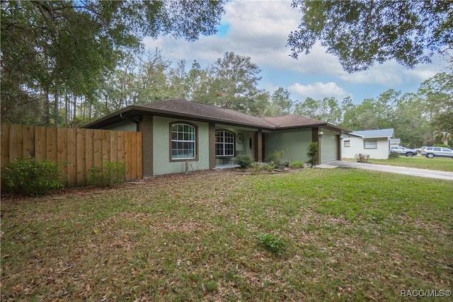 ranch-style house with a front yard and a garage