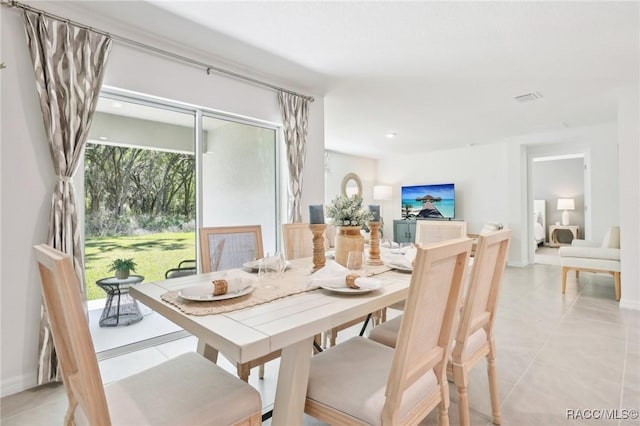 3342 W Crandon Dr, Dunnellon, FL 34433 - dining room with light tile patterned floors and baseboards