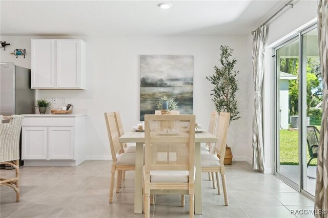3342 W Crandon Dr, Dunnellon, FL 34433 - dining space featuring healthy amount of natural light, light tile patterned floors, and baseboards