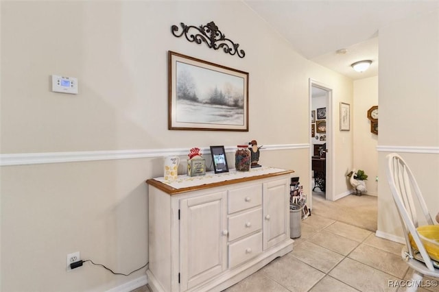 hall with light tile patterned flooring