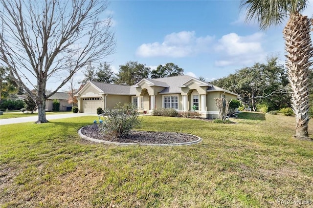 view of front of property with a garage and a front lawn