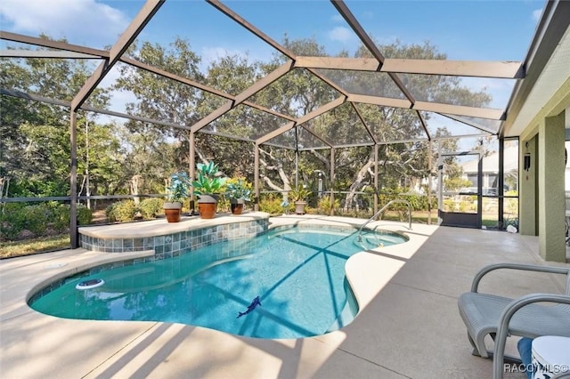 view of pool with a lanai and a patio area