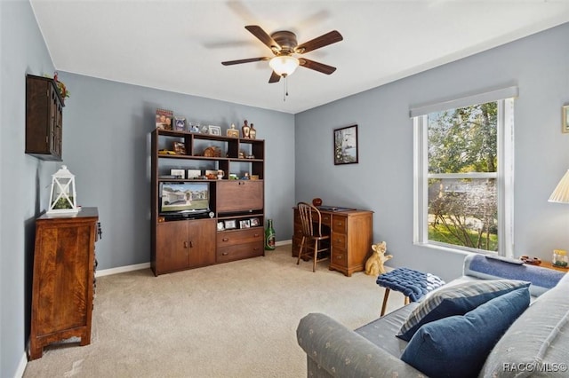 living area with ceiling fan and light colored carpet