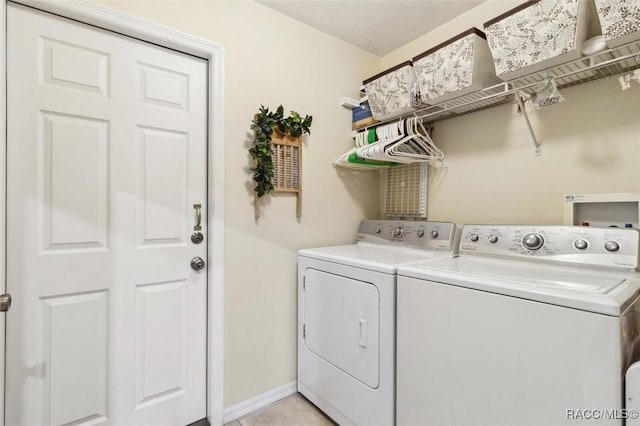 laundry room with separate washer and dryer