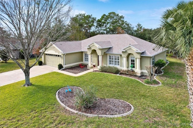 ranch-style house featuring a front yard and a garage