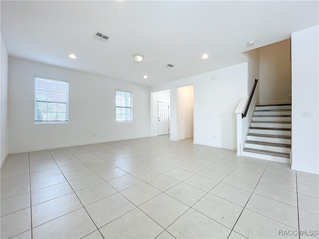 empty room with light tile patterned floors