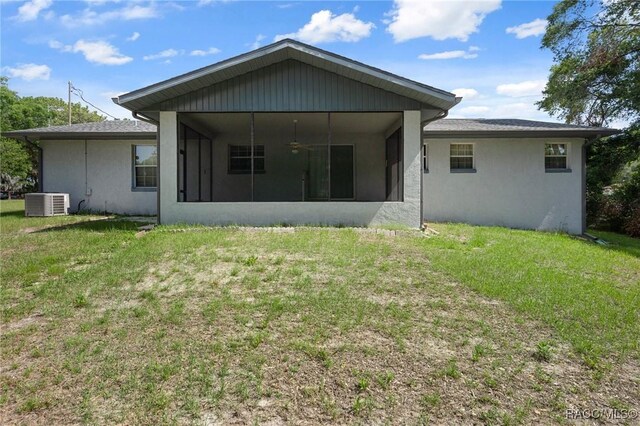 6580 E Glencoe St, Inverness, FL 34452 - rear view of house with a sunroom, a yard, cooling unit, and ceiling fan