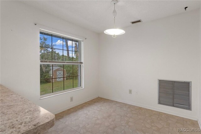 6580 E Glencoe St, Inverness, FL 34452 - unfurnished dining area featuring baseboards