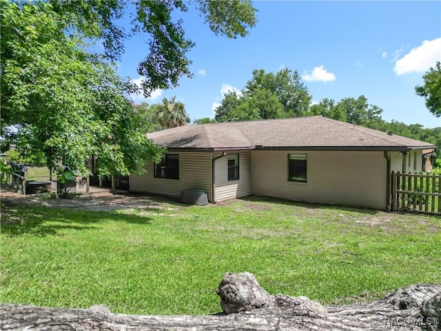 2582 W Fairway Loop, Citrus Springs, FL 34434 - back of house featuring stucco siding and a shingled roof