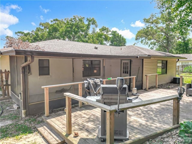 2582 W Fairway Loop, Citrus Springs, FL 34434 - back of house with a wooden deck and roof with shingles