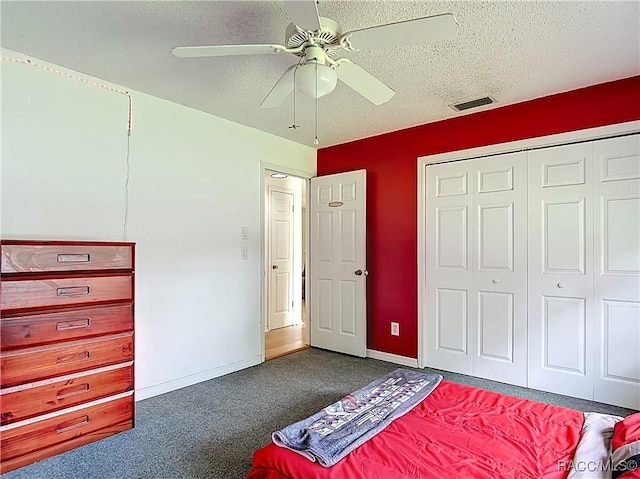 2582 W Fairway Loop, Citrus Springs, FL 34434 - unfurnished bedroom with a textured ceiling, carpet floors, a closet, and ceiling fan