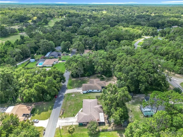 2582 W Fairway Loop, Citrus Springs, FL 34434 - aerial view of property and surrounding area with a heavily wooded area and nearby suburban area