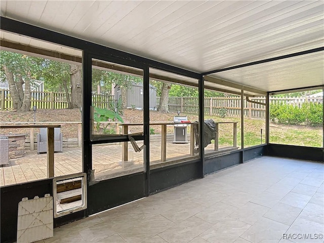 2582 W Fairway Loop, Citrus Springs, FL 34434 - unfurnished sunroom featuring wine cooler