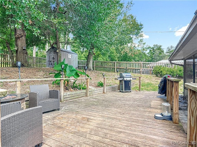 2582 W Fairway Loop, Citrus Springs, FL 34434 - wooden deck with grilling area, a storage unit, and a fenced backyard