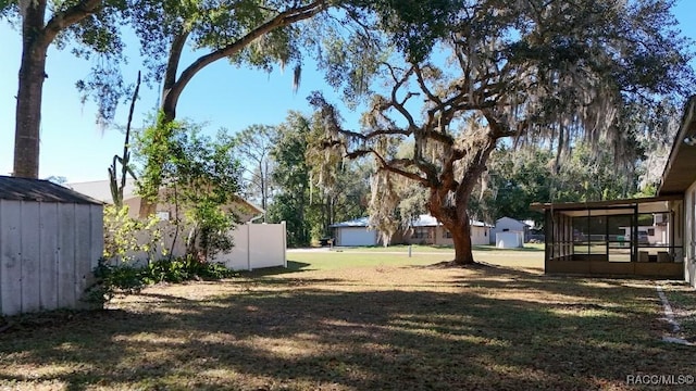 view of yard with a sunroom