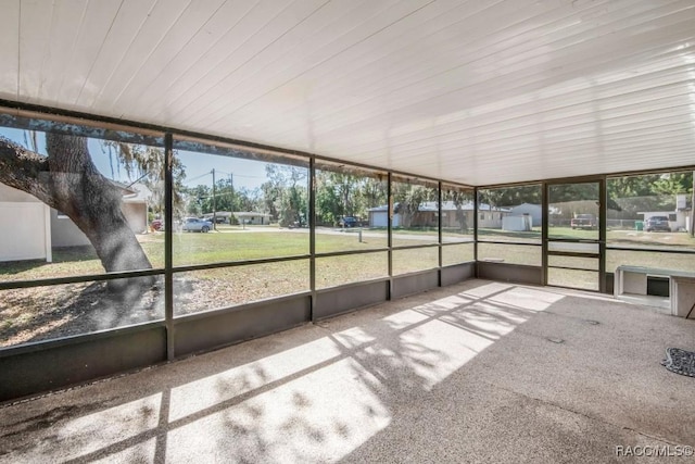 unfurnished sunroom with a wealth of natural light