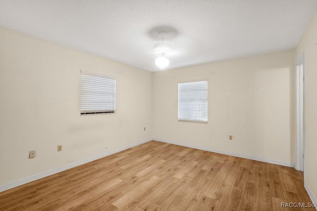 spare room with light hardwood / wood-style floors