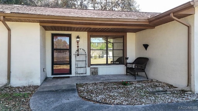 doorway to property with a porch