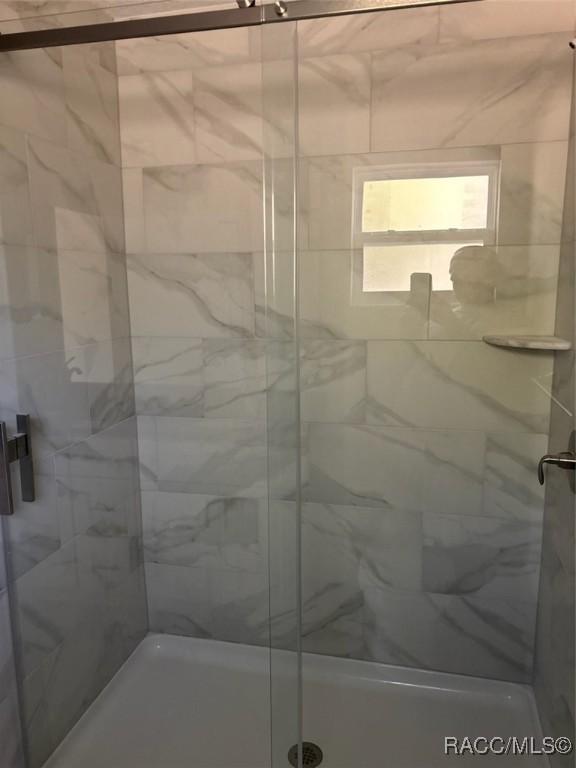 full bath featuring a stall shower