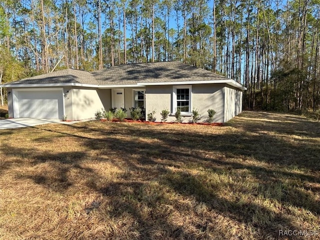 ranch-style house featuring stucco siding, an attached garage, concrete driveway, and a front yard