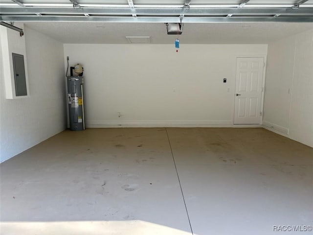 garage with electric panel, electric water heater, and a garage door opener