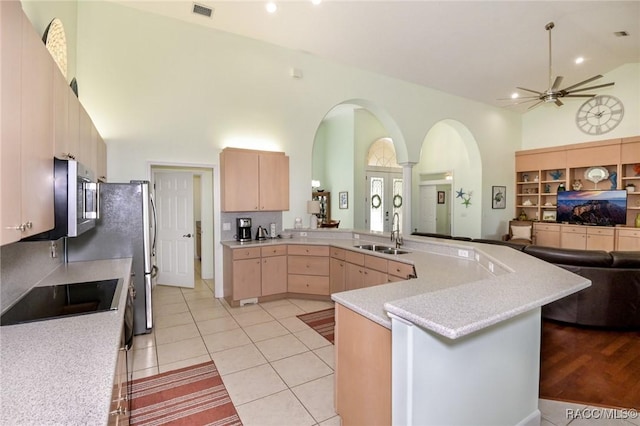 kitchen featuring sink, light tile patterned floors, ceiling fan, black electric cooktop, and light brown cabinetry