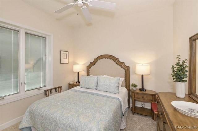 bedroom with light colored carpet and ceiling fan