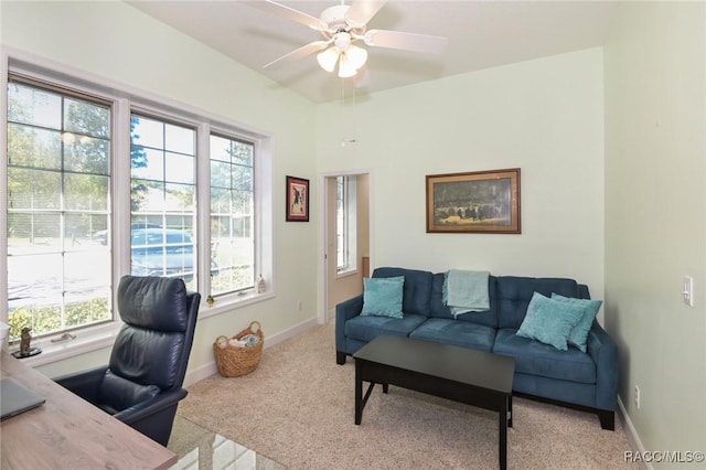 carpeted office space with plenty of natural light and ceiling fan