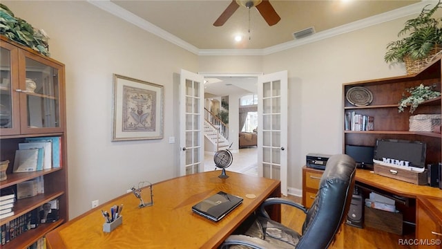 office space featuring visible vents, a ceiling fan, wood finished floors, crown molding, and french doors