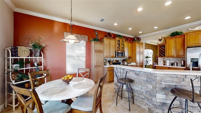 kitchen with stainless steel appliances, light countertops, and crown molding