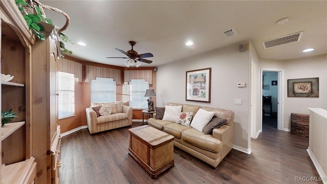 living area featuring dark wood-style floors, baseboards, visible vents, and recessed lighting