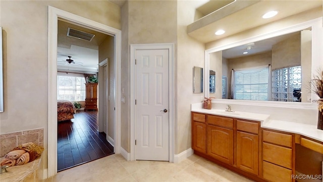 bathroom with tile patterned flooring, connected bathroom, vanity, visible vents, and baseboards