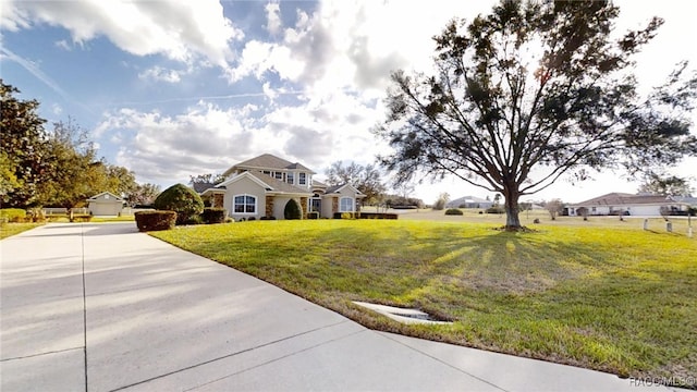 view of front of home with a front lawn