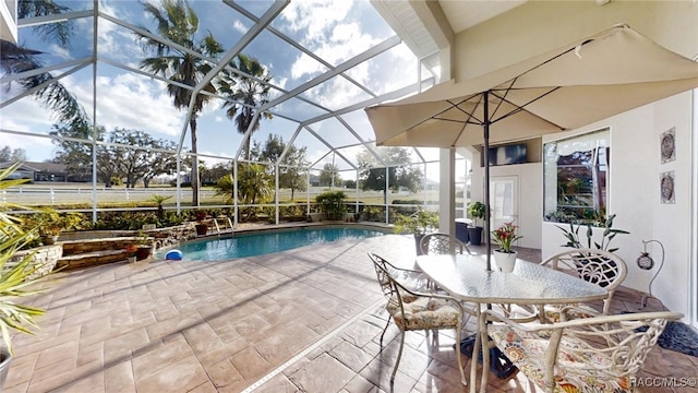 pool featuring a lanai and a patio area