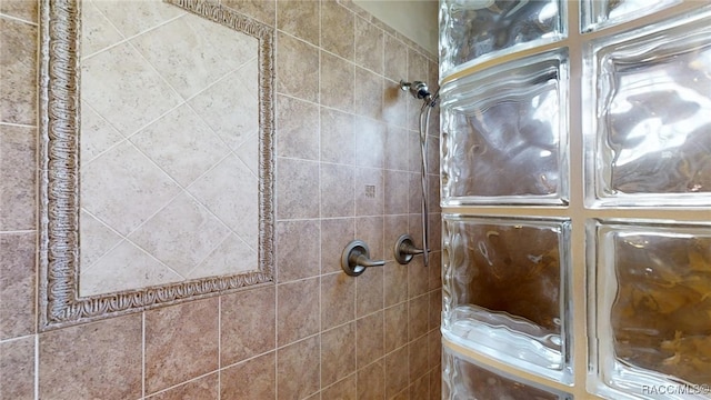 bathroom with tiled shower